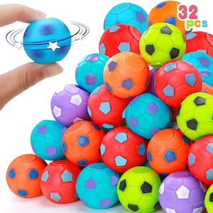 May include: A collection of 32 small, spherical soccer ball toys in various bright colors including red, orange, lime green, blue, and purple. Each ball features a classic hexagonal pattern. One blue ball is shown being held to demonstrate rotation.