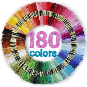 May include: A circular arrangement of 180 individual skeins of embroidery floss in a full spectrum of colors. Each skein is secured with a paper label. The text 180 colors is displayed in the center in pink and blue thread-like lettering.