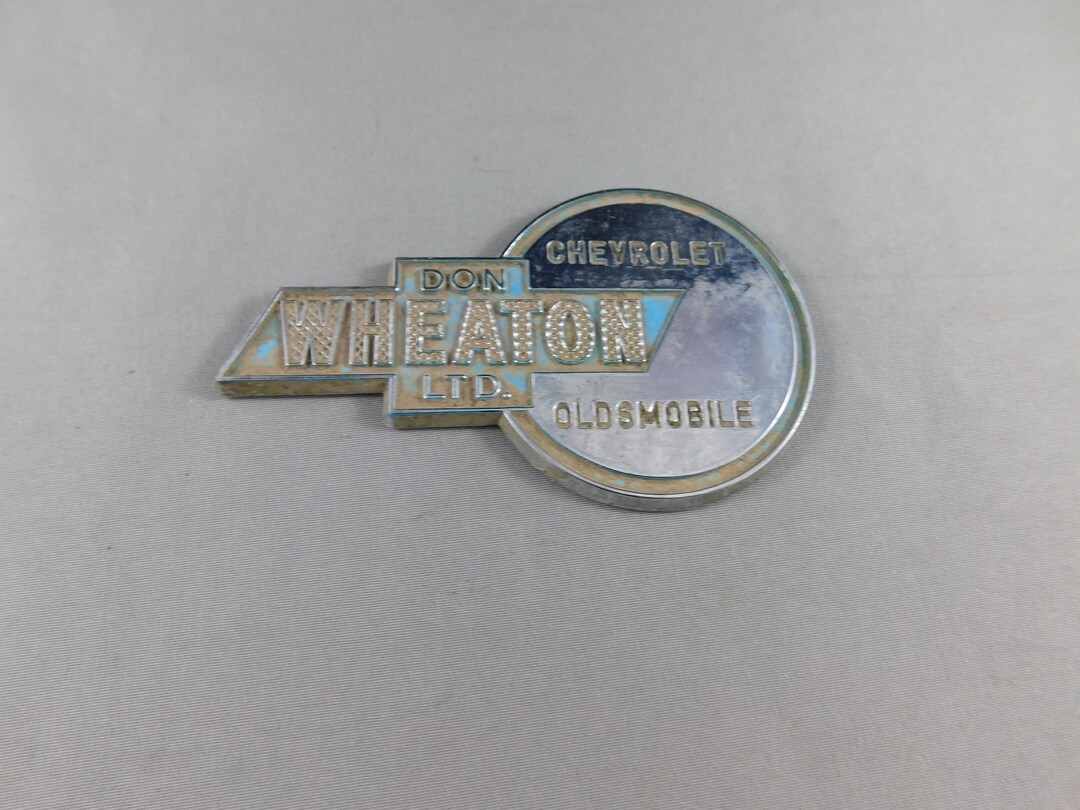 Vintage Don Wheaton Ltd. Chevrolet Oldsmobile Car Plastic Dealer Badge