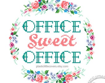 May include: Cross stitch pattern PDF for a floral wreath with the text "Office Sweet Office" in teal and pink lettering. The pattern is available on Etsy from plasticlittlecovers.