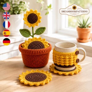 May include: A crochet sunflower set featuring a brown and yellow flower in a terracotta-colored pot, a matching mug cozy with two brown buttons on a ceramic mug, and two sunflower-shaped coasters with dark brown centers and yellow petals.