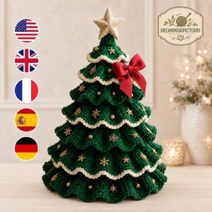 May include: A crocheted dark green Christmas tree with ruffled tiers, cream-coloured edges, and a cream star topper. The tree is decorated with small gold star ornaments, snowflake charms, and a large red satin bow. The text DREAMHOOKPATTERNS is visible.