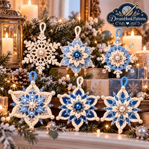 May include: Six handcrafted crochet snowflake ornaments in shades of white and blue, featuring intricate patterns, central pearl-like beads, and small crystal accents. Each ornament includes a loop for hanging, displayed against a festive background.