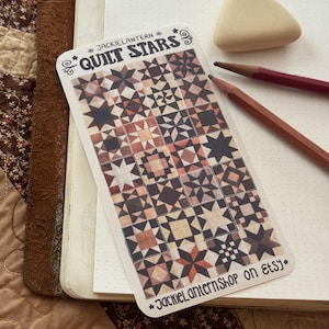 May include: A rectangular sticker featuring a grid of various star-patterned quilt blocks in shades of brown, tan, and cream. The top text reads "JACKIELANTERN QUILT STARS" and the bottom text reads "JackielanternShop on Etsy" with star accents.