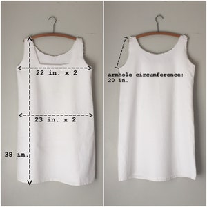 May include: White sleeveless dress with a scalloped neckline and a length of 38 inches. The dress measures 22 inches across the chest and 23 inches across the waist.