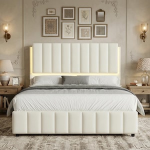 May include: A cream-colored upholstered bed frame featuring a tall, vertical channel-tufted headboard with integrated warm LED backlighting. The bed includes a matching channel-tufted base, white bedding, and a gray accent pillow centered on the mattress.