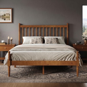 May include: A wooden bed frame with a tall headboard and footboard featuring a spindle design. The bed is dressed in light-colored bedding with two patterned throw pillows. Two matching wooden nightstands with spindle legs flank the bed.