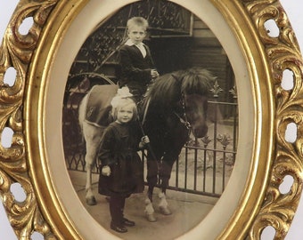 Children With Pony Picture, framed photo circa 1920, boy and girl with Shetland pony