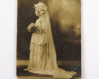 Vintage Photo, wedding flower girl, sepiatone, white gown, bonnet, flowers, profile standing portrait