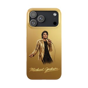 May include: A gold-colored smartphone case featuring a graphic illustration of Michael Jackson wearing a sequined gold blazer and black shirt while holding a microphone. The name Michael Jackson is printed in a cursive gold script at the bottom.