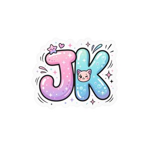 May include: A sticker featuring the letters JK in a bubble font. The J is a pink and purple gradient, and the K is a blue gradient with bubbles. A small pink cat face is centered on the K, and a smiling star and heart are above the J, surrounded by sparkles.