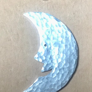 Silver Recycled aluminium Moon Face brooch. Light weight and non tarnish