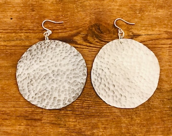 Silver aluminium large disc earrings.