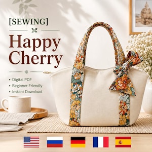 Pode incluir: Uma bolsa tote na cor creme com duas alças verticais com estampa floral em laranja, amarelo e verde. Um laço floral correspondente está preso à alça direita. O texto [SEWING] Happy Cherry é visível no lado esquerdo da imagem.