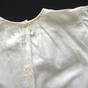Vintage Baby Dress: 1960s, White Cotton Lawn w/ Pink & Blue Embroidery, Cap Sleeves / Button Front