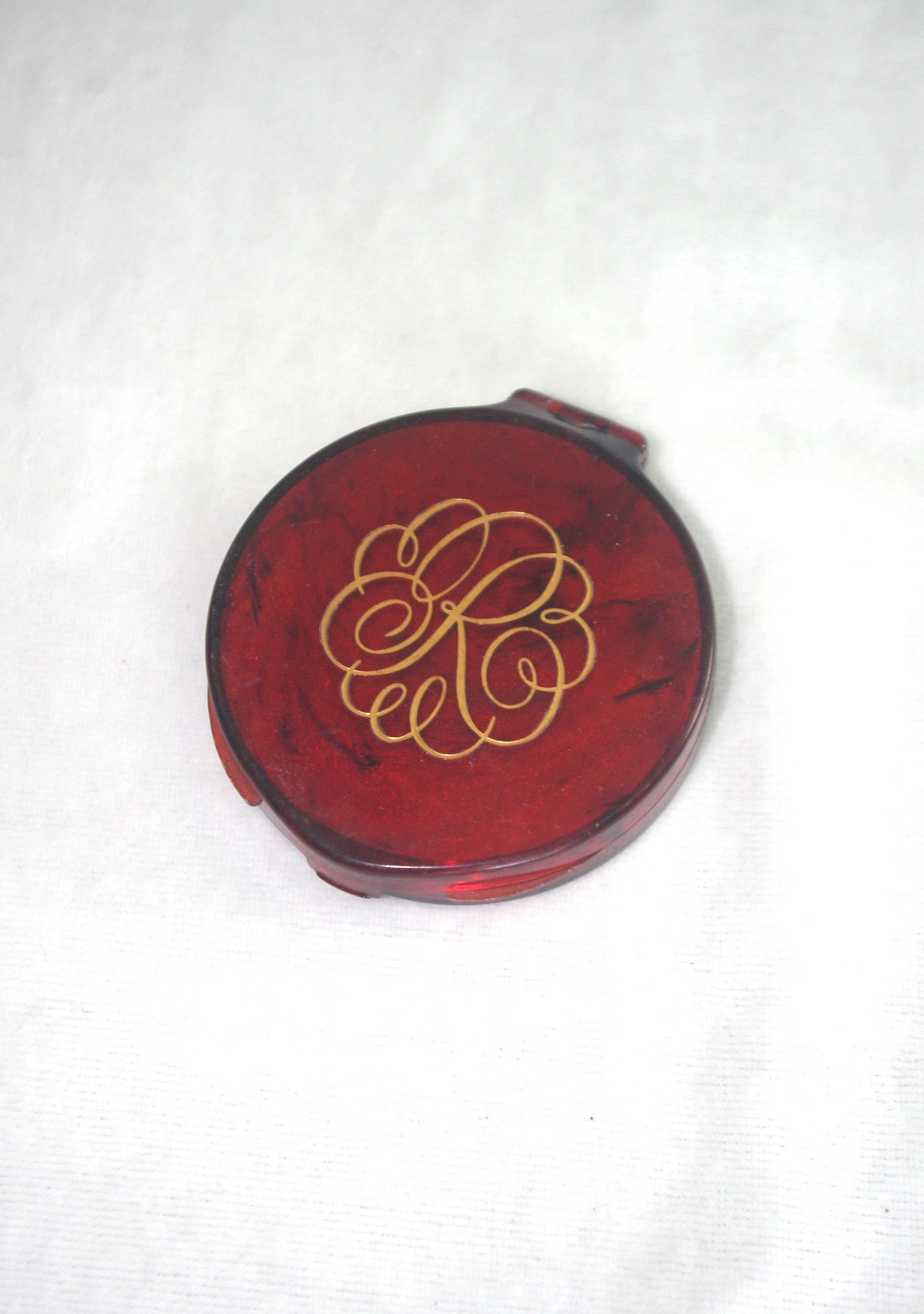 Portamonete vintage compatto: "Revlon Love-Pat" color tartaruga con logo "R", "Light", anni '70/'70