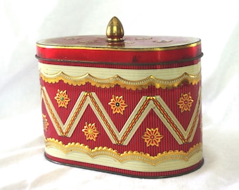 Lata de dulces/golosinas vintage: ovalada, floral/flores y galones con tapa suelta, roja, dorada, blanca, década de 1960/años 60