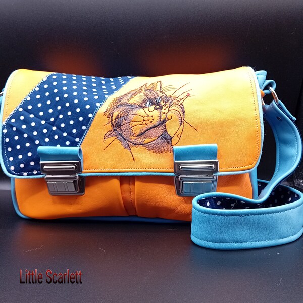 sac bandouliere fermoir cartable en cuir bleu et orange broderie chat