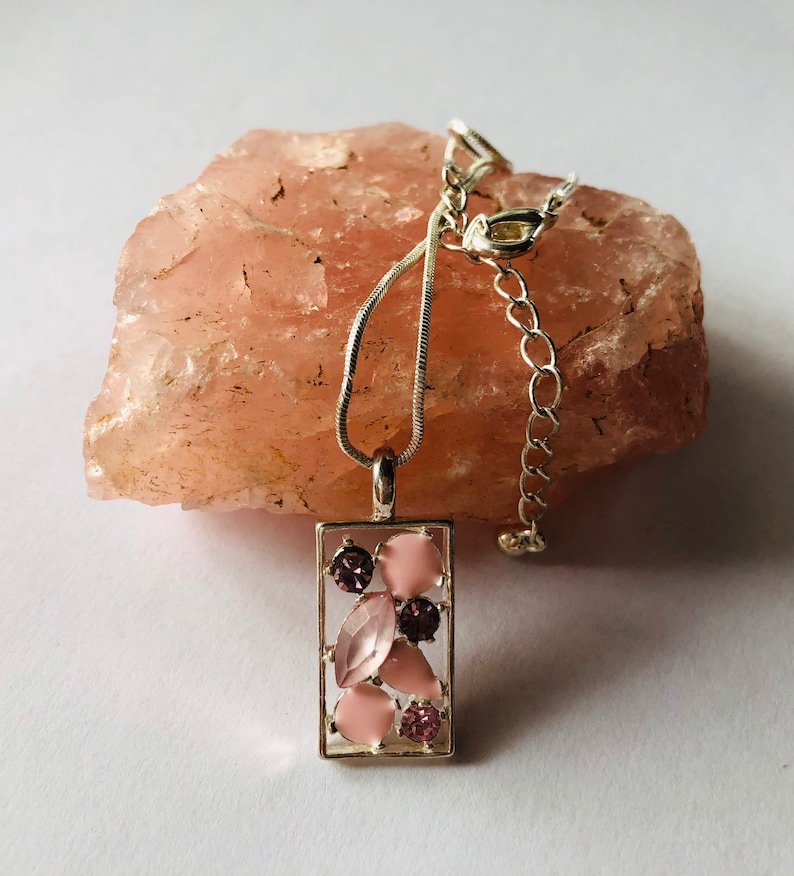 Necklace pendance,rectangle silver plated bezel with an eclectic mix of pink stones and a silver plated snake chain.