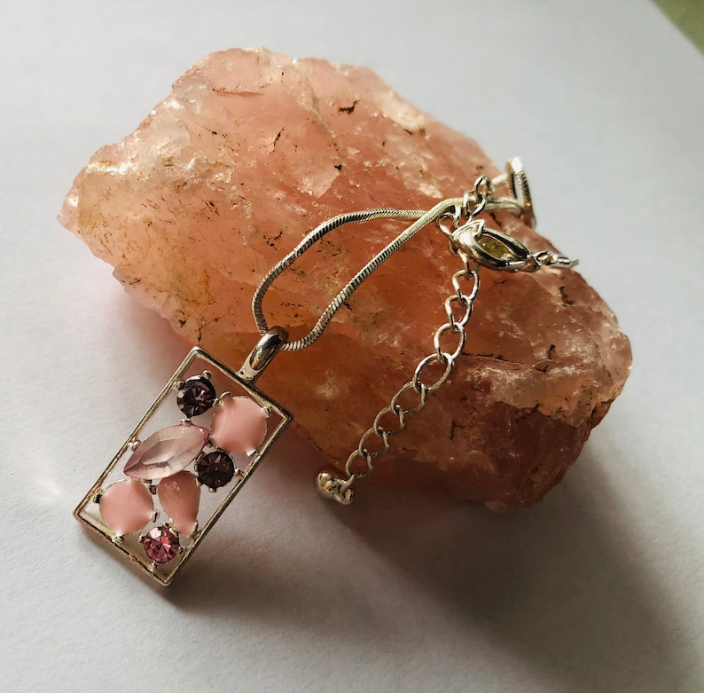 Necklace pendance,rectangle silver plated bezel with an eclectic mix of pink stones and a silver plated snake chain.