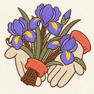 May include: An embroidery design featuring two light-toned hands cupped together, holding a bouquet of three purple irises with yellow centers and green stems. The stems are wrapped in a brown textured material with a bright orange cuff accent.