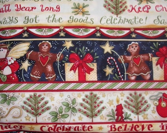 May include: Christmas-themed fabric with festive illustrations. The design features gingerbread people, wrapped gifts, stars, and Christmas trees. The fabric has text that reads "Always got the goods Celebrate!" and "Believe in". The color palette includes red, green, and cream.