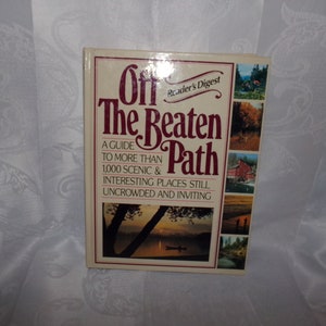 May include: A book titled "Off The Beaten Path" by Reader's Digest, a guide to more than 1,000 scenic and interesting places still uncrowded and inviting.
