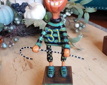 Pumpkin tap dancing, whimsical pumpkin with a black and white cane, colorful pumpkin character, handmade air dry clay Halloween character