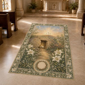 May include: A rectangular floor rug featuring a religious scene of an open stone tomb with three crosses on a hill under a sunrise. The border is decorated with white lilies and green foliage, with a crown of thorns centred at the bottom.
