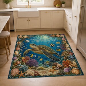 May include: A rectangular area rug featuring a detailed underwater scene with a large sea turtle swimming in the centre, surrounded by colourful coral reefs, various tropical fish, and scattered seashells along the border on a blue background.