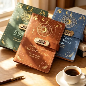 May include: Three journals in green, brown, and blue with gold celestial foil stamping, combination locks, and personalized text. The brown journal features the text Lucas & Arthur 2026.1.1, while the others show Sam and Oliver's Writing.