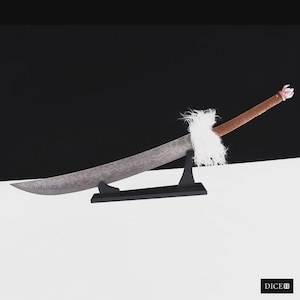 May include: A curved sword with a patterned grey blade, a brown wrapped handle, and a white faux fur accent at the hilt. The sword is displayed on a black stand. The word DICE is printed in white in the bottom right corner of the image.