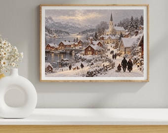 May include: A framed wall art print depicting a snowy winter village scene at dusk. The image features rustic houses with glowing windows, a church with a tall steeple, a frozen lake, and people walking along a snow-covered path.