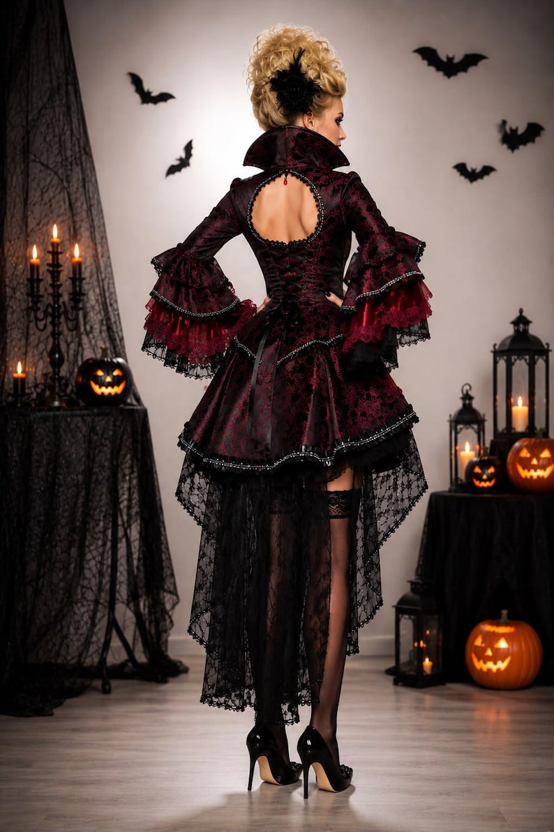 May include: A dark burgundy and black dress featuring a high collar, a circular back cutout, and layered bell sleeves with lace trim. The skirt has a high-low hemline with a long black lace train, paired with black stockings and high-heeled shoes.