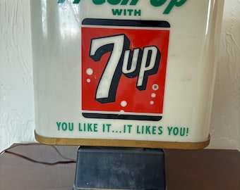 Letrero publicitario giratorio vintage de 7-Up, luz encendida y funcionando