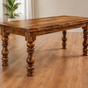 May include: A rectangular dining table crafted from dark brown wood with a visible grain pattern. The table features a thick, flat top surface and four sturdy legs, each designed with a distinct turned, bulbous, and stacked spherical shape.
