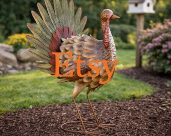 May include: A metal turkey garden sculpture featuring layered, textured feathers in shades of brown, bronze, and green. The figure has a detailed neck with a red wattle and stands on thin metal wire legs. The word Etsy is overlaid in orange.