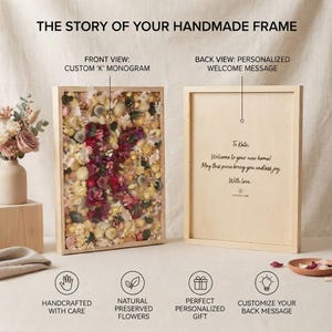 May include: A wooden frame containing preserved flowers arranged in the shape of the letter K. The back of the frame features a personalized message that reads: To Kate: Welcome to your new home! May this piece bring you endless joy. With love.