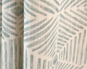 May include: A fabric curtain featuring a repeating geometric pattern of sage green lines on an off-white background. The design consists of angled, hand-drawn style strokes that form interconnected hexagonal shapes across the textured textile surface.