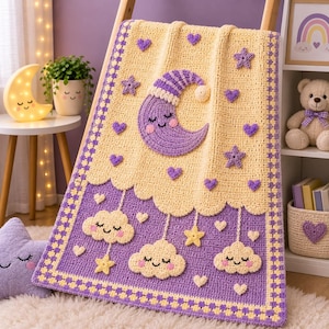 May include: A rectangular crochet blanket featuring a pale yellow top section with a purple crescent moon wearing a nightcap, surrounded by small purple hearts and stars. The bottom section is purple with three smiling clouds and yellow stars.