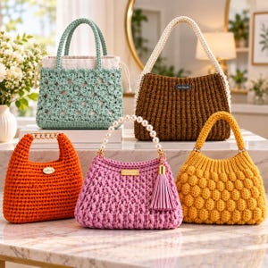 May include: Five crocheted handbags in various colors and textures. The collection includes a light green floral pattern bag, a brown ribbed bag, an orange bag with a gold chain handle, a pink bag with a pearl handle and tassel, and a yellow bobble stitch bag.