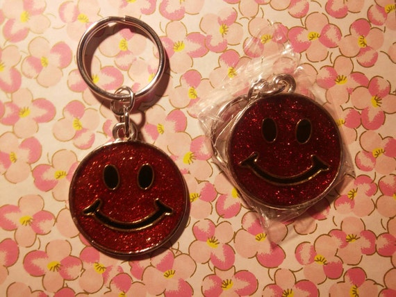 2 HAPPY FACE KEYRINGS