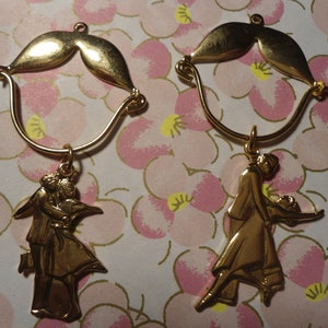 2 Goldplated Charm Holders with 1 Assorted Dancer Charms Each