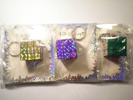 3 Assorted Colors Rubiks Cube Key Chains Key Rings - image 1