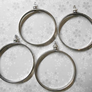 2 cache-pièces plaqués argent de 40 mm