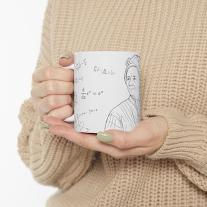 May include: A white ceramic mug featuring a black line drawing of a person wearing a head covering, accompanied by various mathematical formulas and symbols including the derivative of e to the power of x, printed on the exterior surface.