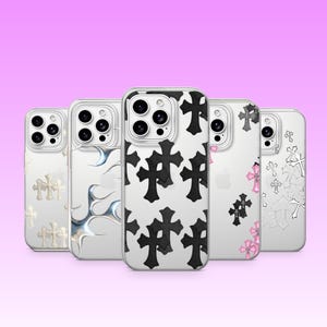 May include: Five clear smartphone cases arranged in a row. The cases feature various designs including white, metallic silver, black, and pink cross patterns, as well as metallic silver flame-like graphics, all with cutouts for camera lenses.