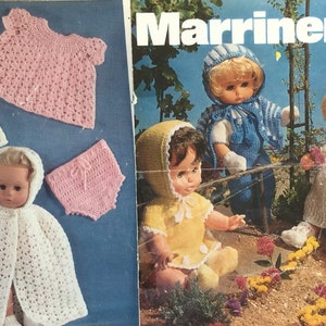May include: A crochet pattern booklet for making doll clothes. The cover features three dolls wearing crocheted outfits. The dolls are wearing a yellow dress, a blue jumpsuit, and a white dress. The text on the cover reads "Marriner 1692 10p DK/4ply 12-18ins 30-46cm".