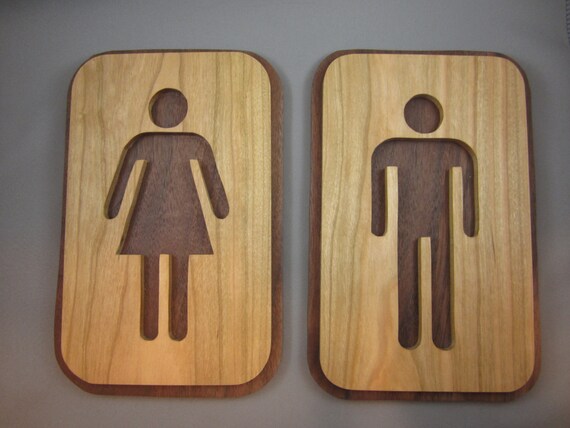 A Pair of His and Hers Bathroom Signs