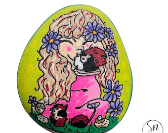 Hand-Painted Large Stone with Smiling Blonde Girl and Guinea Pigs Amidst Purple Flowers